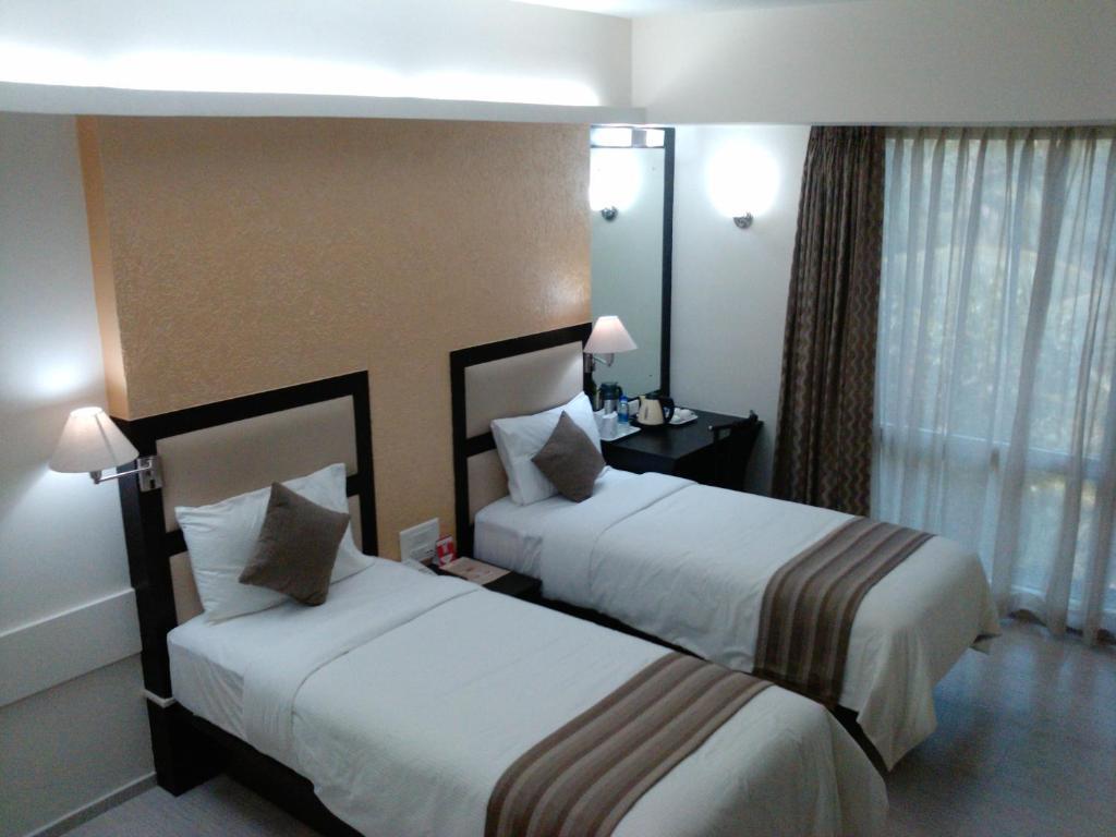 Pattom Royal Hotel Thiruvananthapuram Quarto foto
